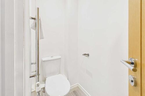 a bathroom with a white toilet in a stall at Host & Stay - Bayview Lodge in Beadnell