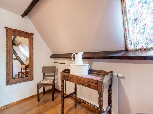 a room with a table with a bucket on it at Farmhouse in Beveren near Beach & Garden in Beveren