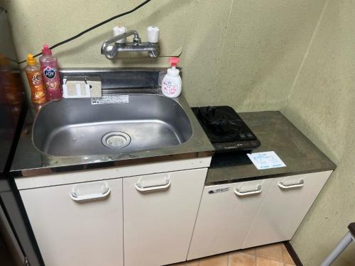 a kitchen with a sink and a stove at Osaka - House - Vacation STAY 9690 in Osaka