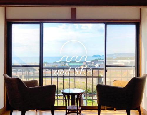 a large window with a view of the ocean at and SEA Kamogawa - Vacation STAY 07561v in Kamogawa