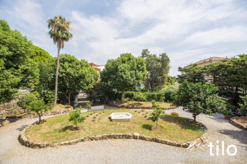 a garden with a boat in the middle at Villa Aranci | Historical Residence | By Tilo Lux in Genova