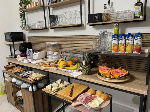 a buffet with many different types of food on display at B&B Marchese SantAndrea in Licata