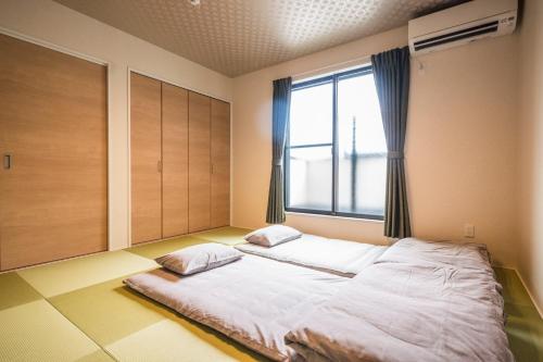 Postel nebo postele na pokoji v ubytování KYOSTAY Iroha Soragi 1 - Vacation STAY 03847v