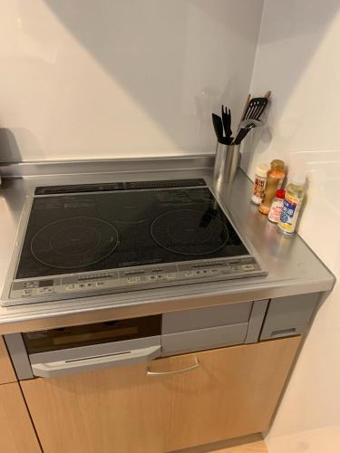 a stove top oven sitting on top of a kitchen counter at HOSHIYAMA - Vacation STAY 64572v in Fujinomiya