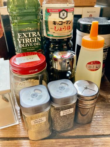 a group of jars of food sitting on a table at Tida House - Vacation STAY 07404v in Koshimizu-shigai