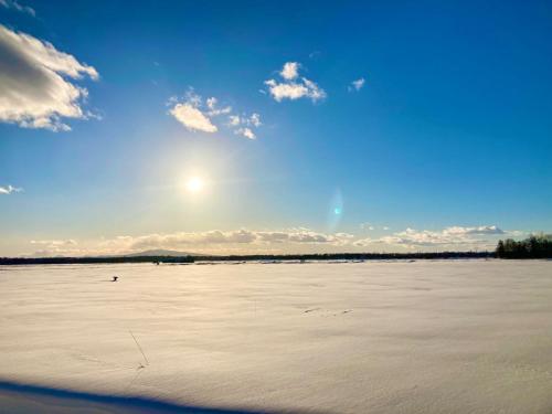 a large body of water with the sun in the sky at Tida House - Vacation STAY 07404v in Koshimizu-shigai