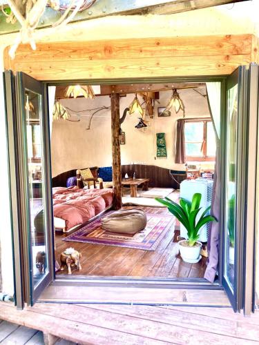 a room with a bed and a dog in it at Tida House - Vacation STAY 07404v in Koshimizu-shigai