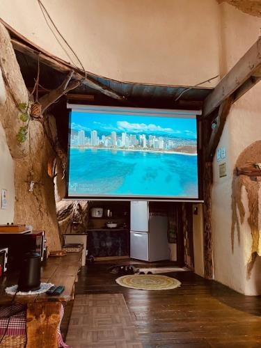 a large flat screen tv in a room at Tida House - Vacation STAY 07404v in Koshimizu-shigai