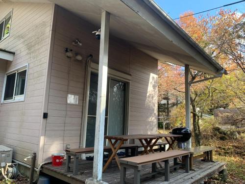 a picnic table on the porch of a house at Shinka Hanare - Vacation STAY 11002v in Oshino