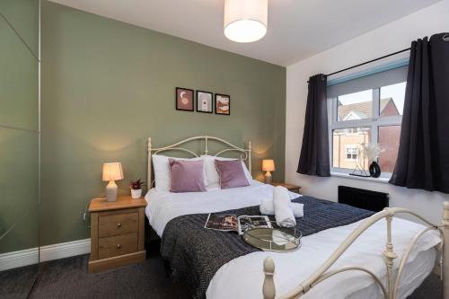 a bedroom with a bed and a window at *Discounts/Contractors/WIFI/Free Parking/Smart TV in Gateshead