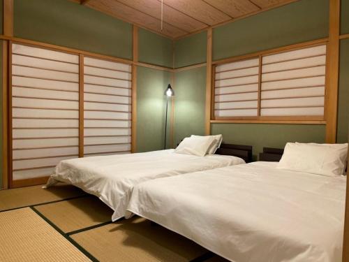 Ένα ή περισσότερα κρεβάτια σε δωμάτιο στο Forest House -Shinka- - Vacation STAY 10539v