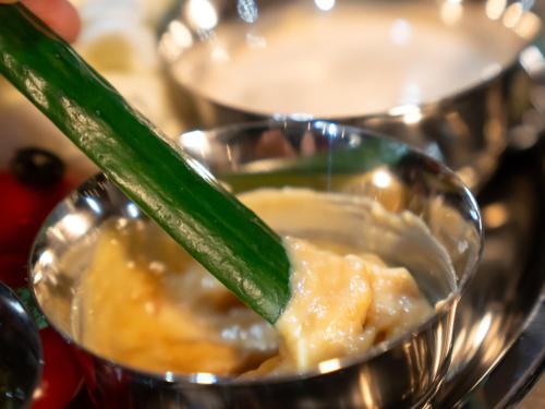 a glass bowl of food with a cucumber in it at Farm Garden Hotel in Numazu