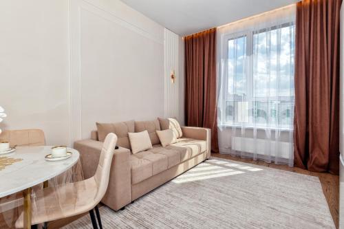 Posezení v ubytování Шикарные апартаменты в Астане