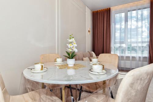 Posezení v ubytování Шикарные апартаменты в Астане