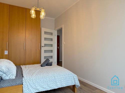 Katil atau katil-katil dalam bilik di Elite Apartment 15 min to Old Town Gdansk