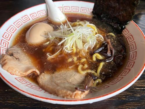 a bowl of soup with meat and noodles at Maeda Forestry House - Vacation STAY 19184v in Furano