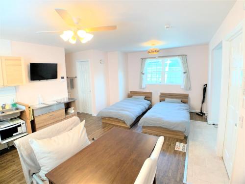 En eller flere senge i et værelse på Alaula - Vacation STAY 34173v