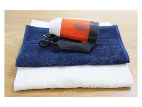 a brush sitting on top of a blue and white towel at Trust Maison Hokkawa - Vacation STAY 24203v in Okawa