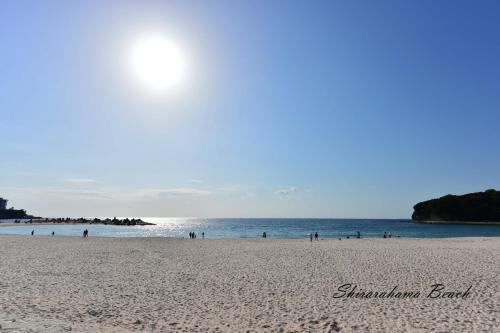 a beach with a group of people in the water at STEP by STEP - Vacation STAY 25753v in Kanayama