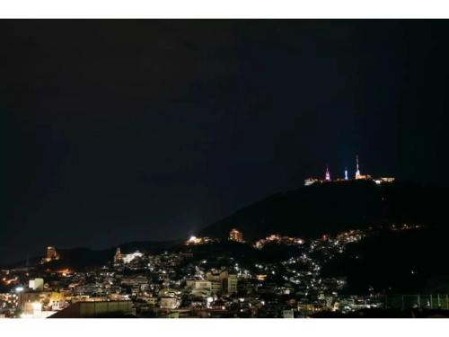 a view of a city at night with lights at gate nagasaki stay&green - Vacation STAY 27220v in Nagasaki