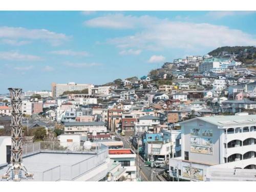 a view of a city with buildings on a hill at gate nagasaki stay&green - Vacation STAY 27220v in Nagasaki