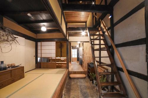 a room with a spiral staircase in a building at Light Tomoru - Vacation STAY 25289v in Oda