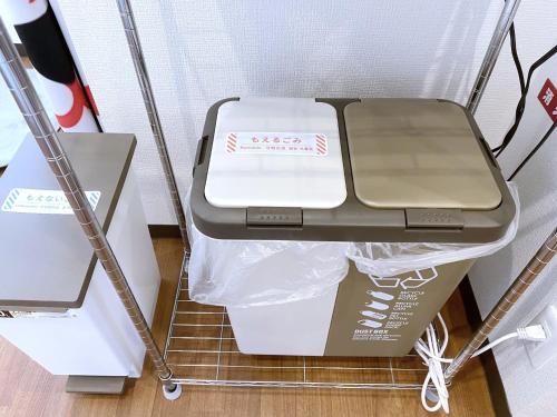 a drawer in a shelf with a box in it at SKYE HOME MINPAKU - Vacation STAY 11856 in Tokyo