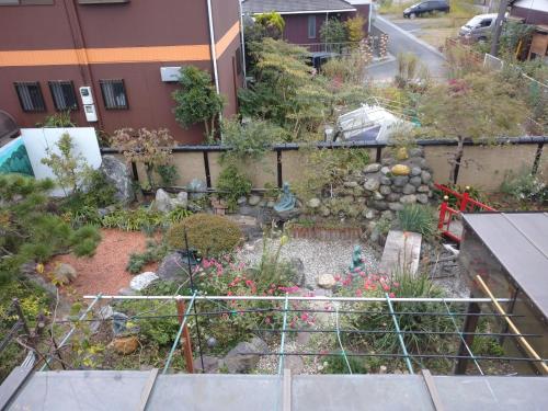 a garden on the side of a building at Kōnotori no sato no yado - Vacation STAY 11111 in Kōnosu