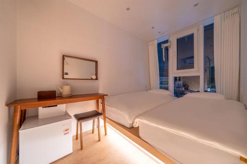 Katil atau katil-katil dalam bilik di Nomad Stay in Hongdae
