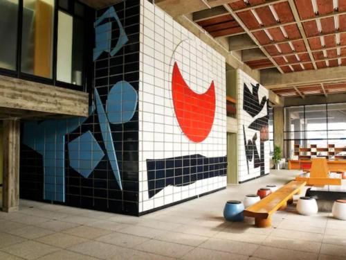 a room with benches and a mural on the wall at Hiyorian - Vacation STAY 11234 in Takamatsu