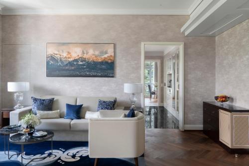 a living room with a couch and a table at Grand Resort Bad Ragaz in Bad Ragaz