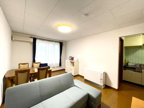 a living room with a couch and a table at Avidasion - Vacation STAY 13341 in Biei