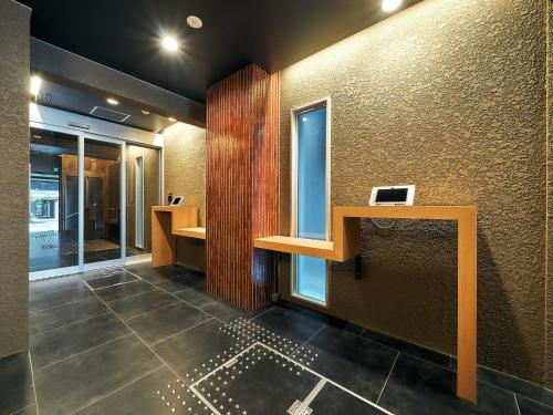 an office lobby with a desk and a window at Rakuten STAY Hakata Gion 301 Superior Room in Fukuoka