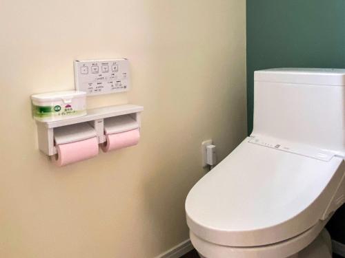 a bathroom with a white toilet in a room at Yonehara Beach Stay LUANA - Vacation STAY 38711v in Fukai