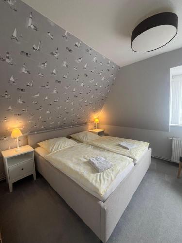Postel nebo postele na pokoji v ubytování Haus-Seeschwalbe-Wohnung-2