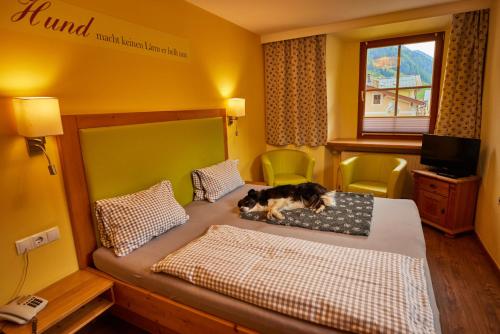 Ένα ή περισσότερα κρεβάτια σε δωμάτιο στο Hotel Grimming dogs&friends