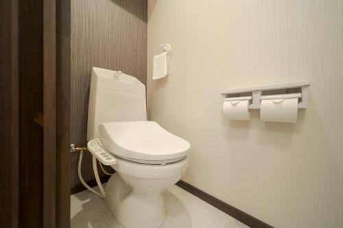 a bathroom with a white toilet in a room at Tabi no yado Hanakeshiki Botan 4th floor - Vacation STAY 43035v in Yufuin