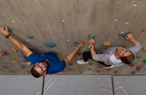 two people on a climbing wall at Unicare Røros in Røros