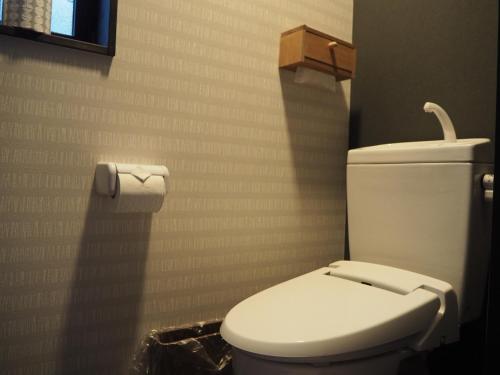 a bathroom with a toilet and a roll of toilet paper at camebiori - Vacation STAY 44988v in Onomichi