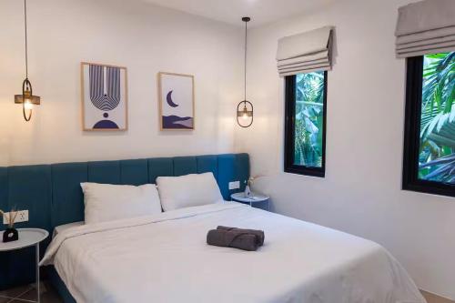 Ένα ή περισσότερα κρεβάτια σε δωμάτιο στο Lotus Enzio unit 16 - 2 Bedrooms Canggu