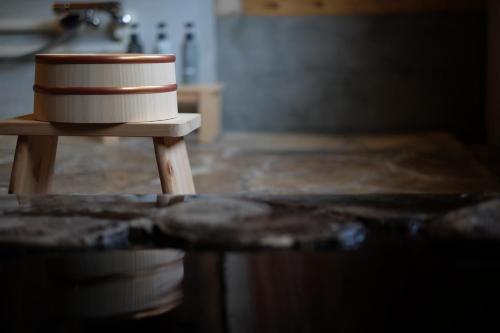 a cake sitting on top of a wooden table at iORi Yufuin - Vacation STAY 42351v in Yufuin