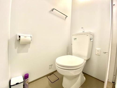 a bathroom with a white toilet in a stall at Le Soleil Asato - Vacation STAY 48667v in Naha