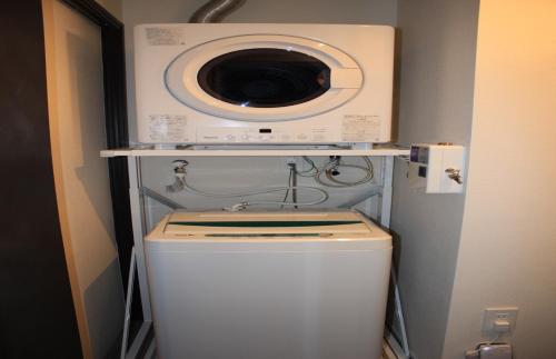 a washing machine sitting on top of a washer at Gate into Nago - Vacation STAY 49122v in Nago