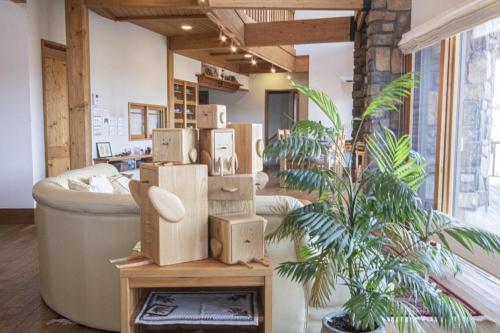 a room with boxes on a table next to a couch at Sanso Harunoki staff-resident type - Vacation STAY 11615 in Furano