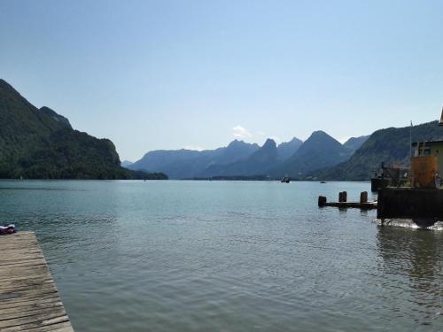 a view of a lake with mountains in the background at Abis Ferienwohnung Salzkammergut in Strobl