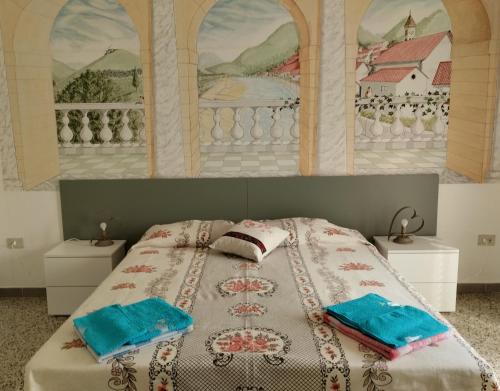 a bedroom with a bed with two pillows on it at Gorofai in Bitti