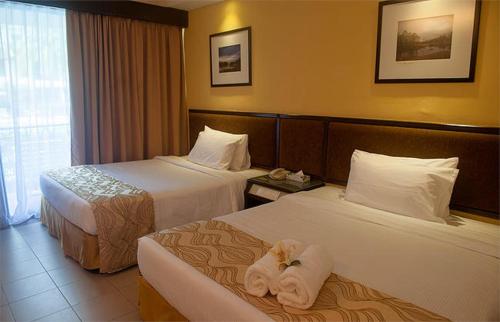 Ένα ή περισσότερα κρεβάτια σε δωμάτιο στο Residence Inn Cherating