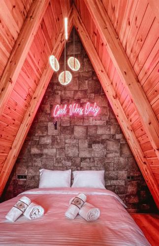 a bed in a attic with a sign that reads cool wiser study at Ala World Resort in Kartepe