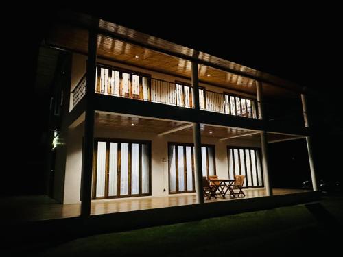 a model of a house at night with a table at Ploythai Villa Koh Phangan in Haad Pleayleam