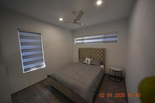 a bedroom with a bed and a window at LOCK, Leave, Work-SELF CONTAINED APARTMENTS in Kelmscott